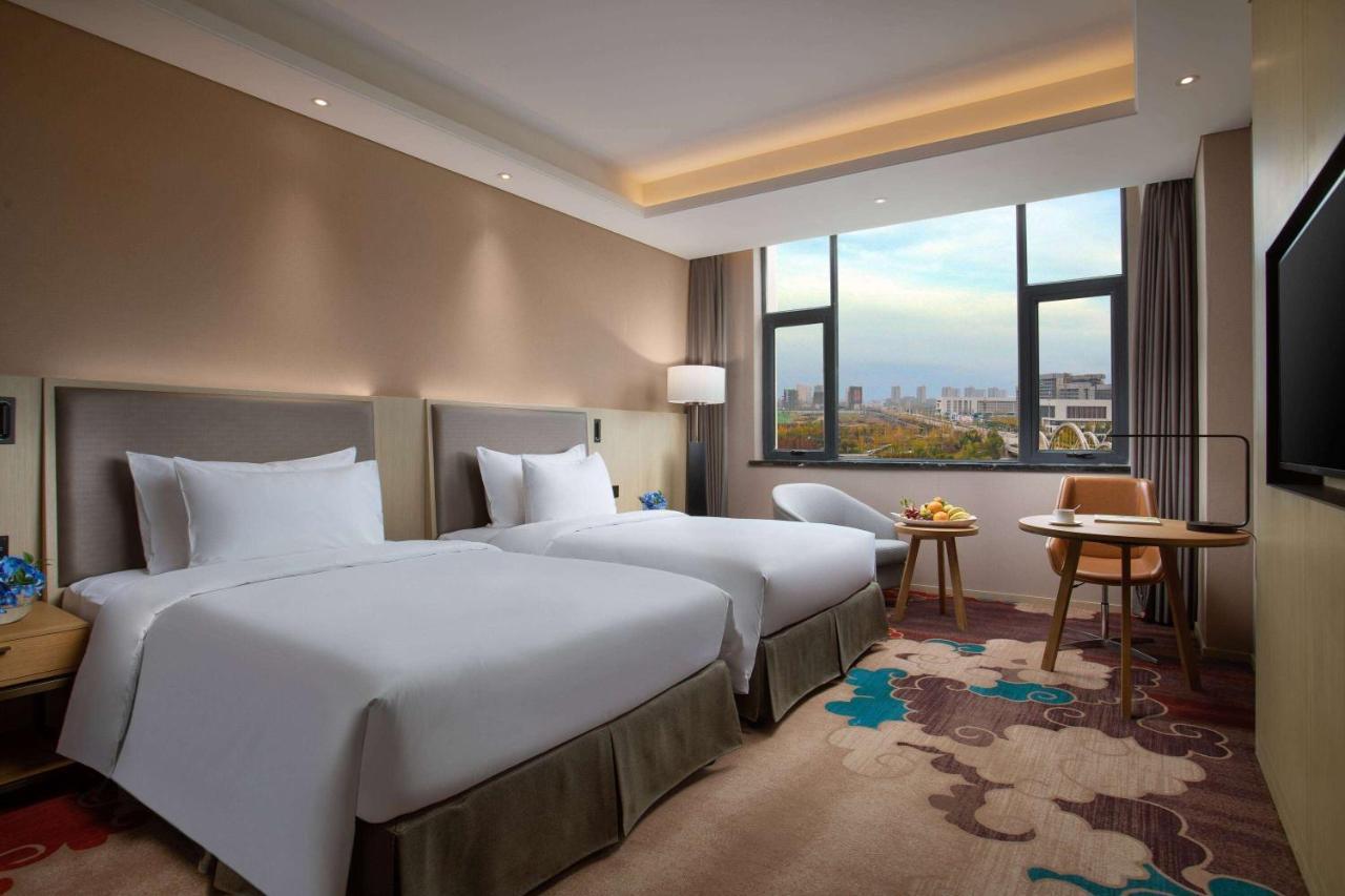 รามาดา วินด์แฮม เจิ้งโจว ซินเจิ้ง Hotel Xinzheng  ภายนอก รูปภาพ