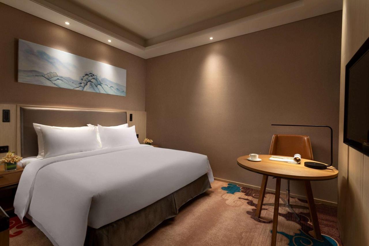 รามาดา วินด์แฮม เจิ้งโจว ซินเจิ้ง Hotel Xinzheng  ภายนอก รูปภาพ
